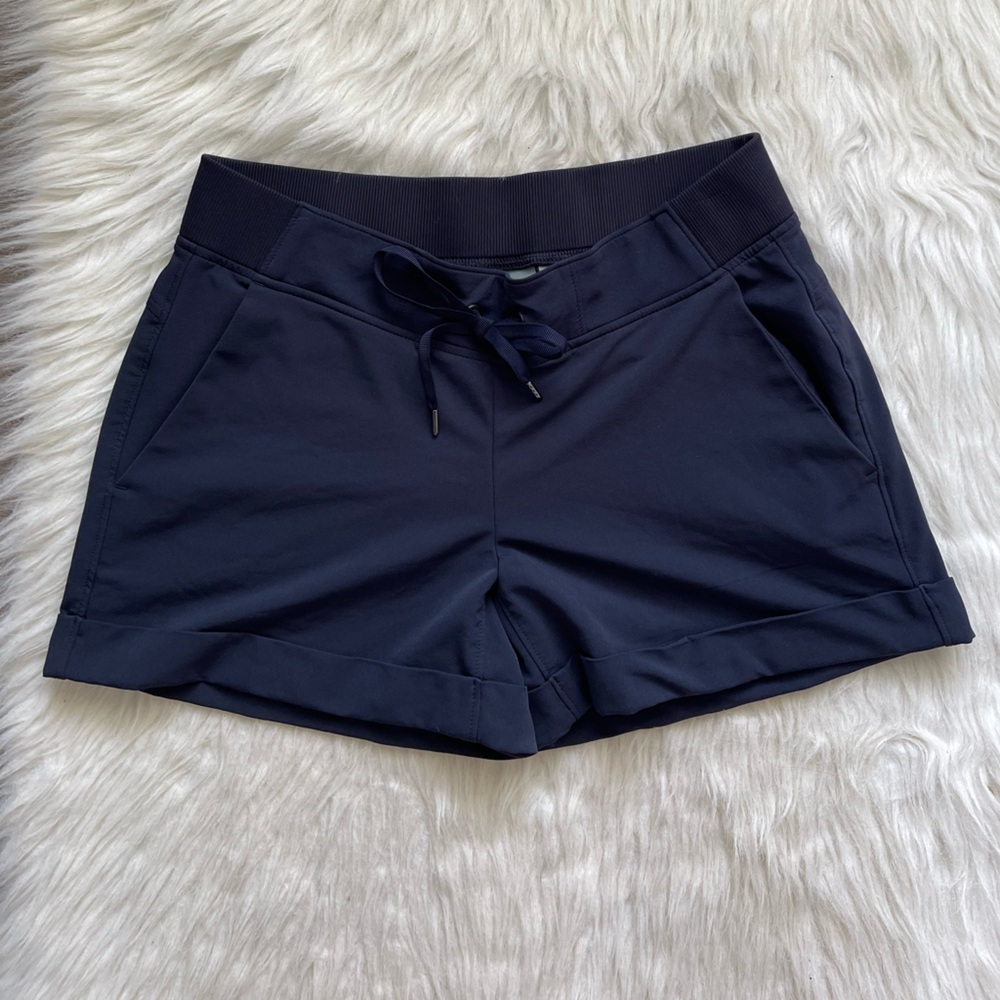 Athleta Navy blue shorts with 2 pockets in front and back and tie waist size 8